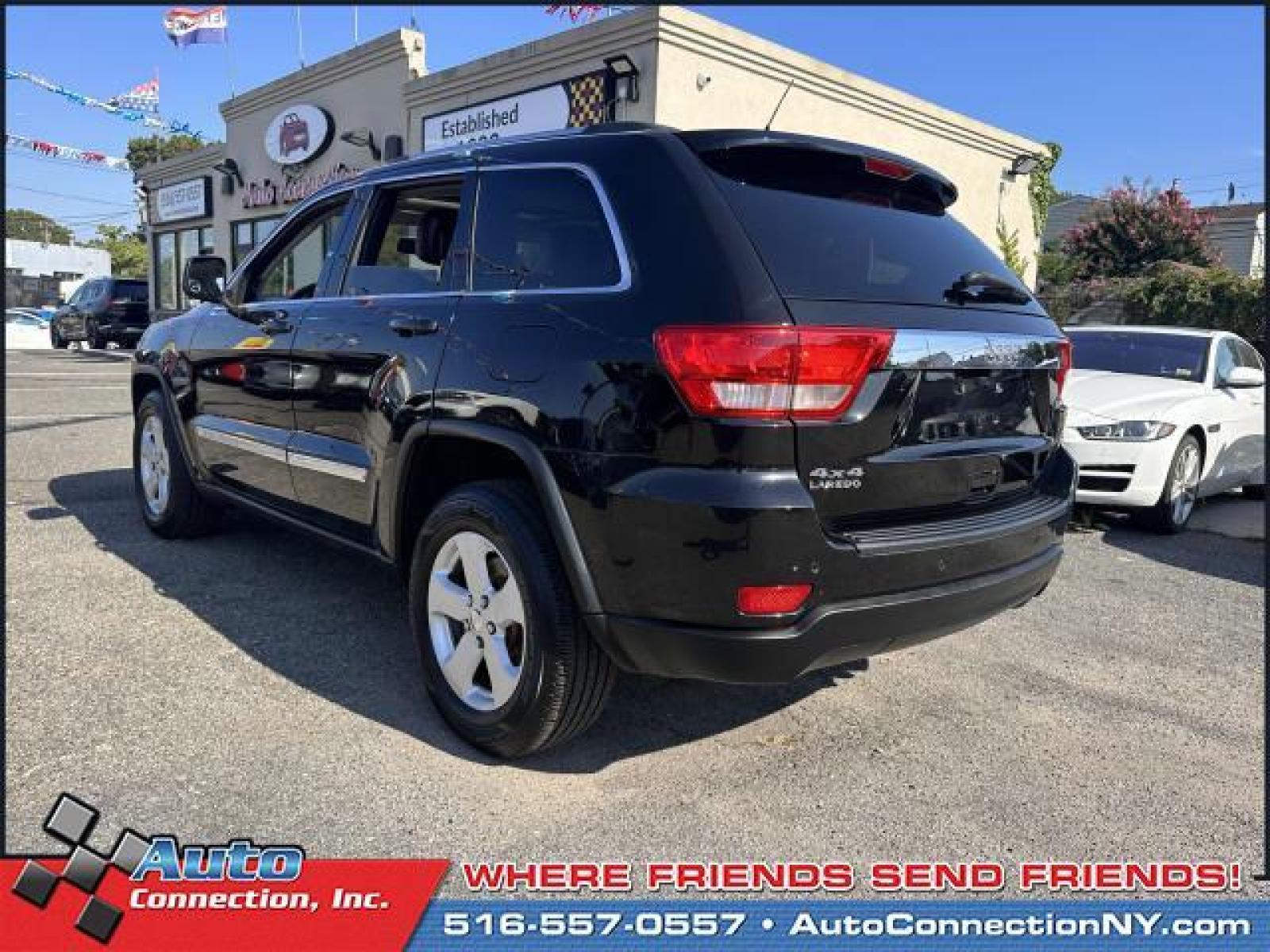 2013 Brilliant Black Crystal Pearl /Black Jeep Grand Cherokee 4WD 4dr Laredo (1C4RJFAG9DC) , Automatic transmission, located at 2860 Sunrise Hwy, Bellmore, NY, 11710, (516) 557-0557, 40.669529, -73.522118 - Designed with a spacious interior, this 2013 Jeep Grand Cherokee is filled with smart features to make your everyday ride more comfortable and convenient. This Grand Cherokee has 106841 miles. We won't sell you a vehicle that we wouldn't sell our family. Come test drive this vehicle today. All inte - Photo #5